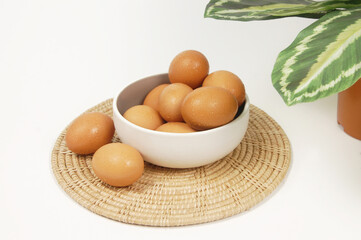 Eggs from the refrigerator with green leaves.