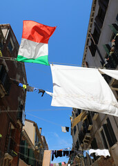 ITALIAN flag and the clothes hung out to dry between the houses of the city