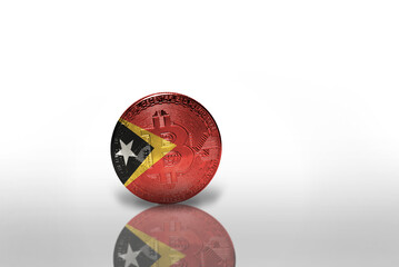 bitcoin with the national flag of east timor on the white background. bitcoin mining concept.