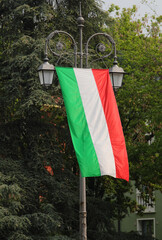 Big Italian flag on the street lamps