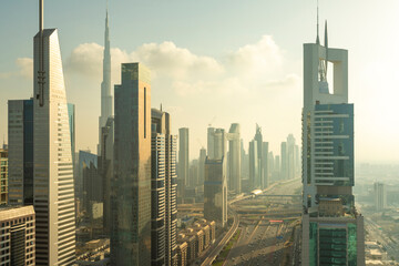 Fototapeta na wymiar Modern towers by the Financial centre with Burj Khalifa in the skyline, Downtown, Dubai, UAE