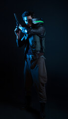 A guy in a cyberpunk image, holding a gun in his hands. Futuristic character in smoke. A young man...