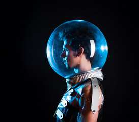 A young man in a helmet, a protective bubble. image in style of retro-futurism. Guy in a plastic...