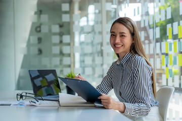 Business woman sign a contract investment professional document agreement in meeting room.