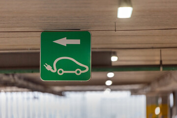 Electric car charging sign in the parking lot