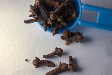 Extreme close up showing pile or collection of rose-apple or clove on white background, also known as laung