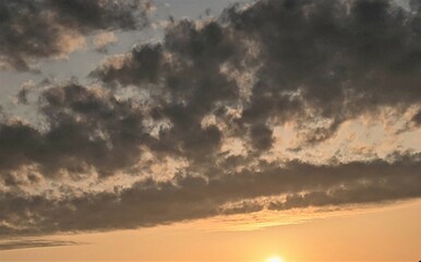 Obraz na płótnie Canvas black clouds in the sunset sky