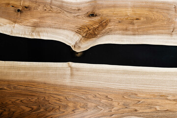 table made of natural wood and black epoxy