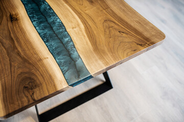 table made of natural wood and black epoxy