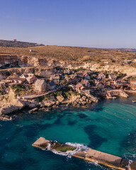Aerial view of Popeye Village. Sunny day, blue sea, blue sky. Mellieha city. Malta