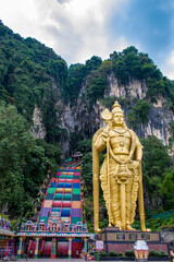Kuala Lumpur Malaysia April 27th 2022: 272 colorful steps and Lord Murugan statue in front of Batu Caves in Gombak, Selangor, which is one of the most popular Hindu shrines outside India.