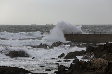 Sea pier being hit by waves