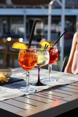 aperitif with aperol crisps on a table