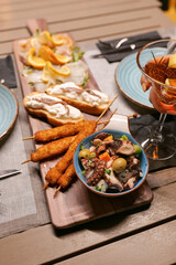 aperitif with aperol crisps on a table