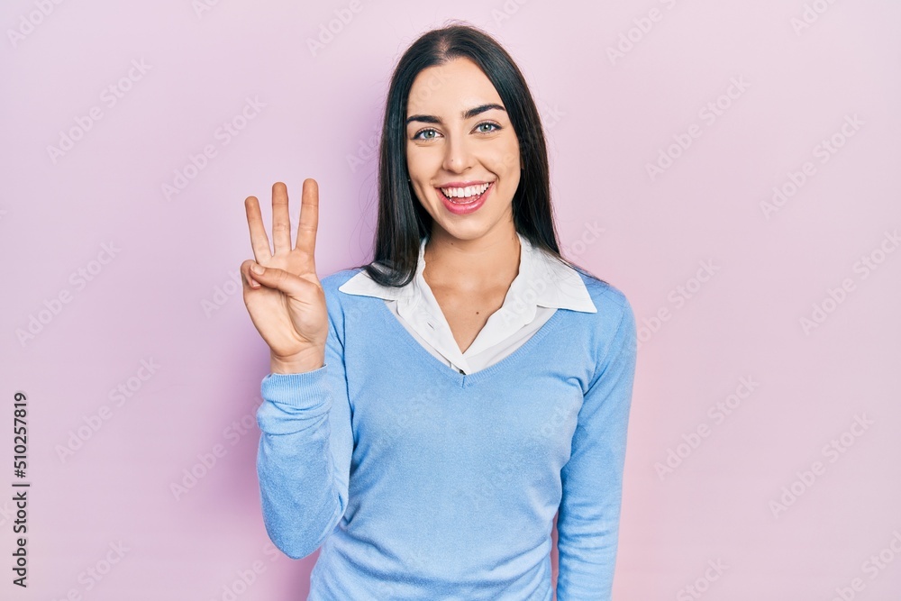 Sticker beautiful woman with blue eyes standing over pink background showing and pointing up with fingers nu