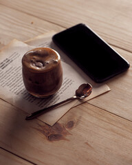 Chocolate coffee and smart phone on wood  table