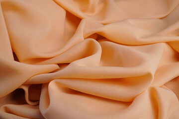 fabric close-up orange or tangerine wave background