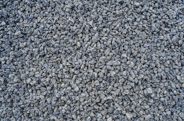 Abstract stone texture. Fine gray gravel. Small gray stones.  Building material.