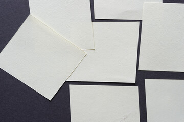 paper squares on gray paper