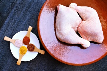 Preparing chicken lags with spices. photo isolate on black top view