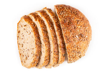 Round healthy bread made of whole wheat flour on sourdough with an appetizing crust with seeds cut into pieces on a white isolated background. Blank for the design. Proper nutrition.