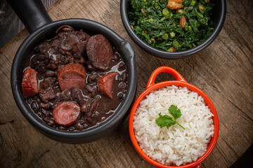 FEIJOADA: typical and traditional food of Brazilian cuisine, served with rice, farofa, orange, pepper and cabbage