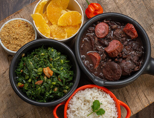 FEIJOADA: typical and traditional food of Brazilian cuisine, served with rice, farofa, orange, pepper and cabbage