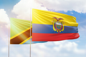 Sunny blue sky and flags of ecuador and tanzania