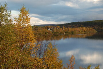 Fototapeta na wymiar Karasjok village reflected in a river, Finnmark, Norway 