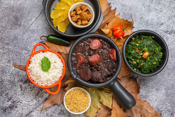 FEIJOADA: typical and traditional food of Brazilian cuisine, served with rice, farofa, orange, pepper and cabbage