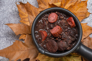 FEIJOADA: typical and traditional food of Brazilian cuisine, served with rice, farofa, orange,...