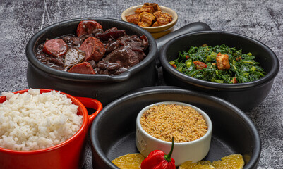 FEIJOADA: typical and traditional food of Brazilian cuisine, served with rice, farofa, orange, pepper and cabbage