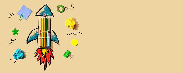 Back to school theme with a rocket with school supplies