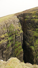 Ásmundarstakkur sea stack on Suðuroy Island in the Faroe Islands.