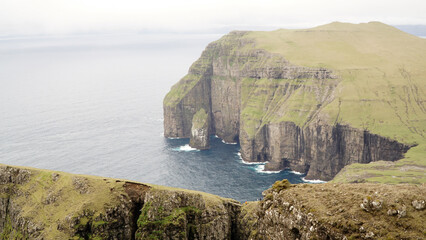 Ásmundarstakkur sea stack on Suðuroy Island in the Faroe Islands.