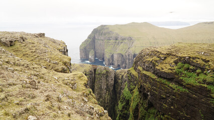 Fototapeta na wymiar Ásmundarstakkur sea stack on Suðuroy Island in the Faroe Islands.