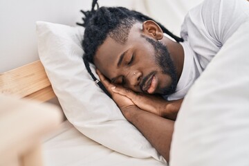 Fototapeta na wymiar African american woman lying on bed sleeping at bedroom