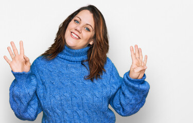 Young plus size woman wearing casual clothes showing and pointing up with fingers number nine while...
