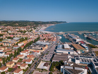 Italy, June 2022; aerial view of Fano with its sea, beaches, port, umbrellas in the marche region