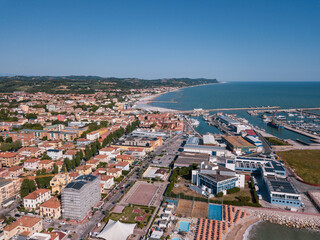 Fototapeta premium Italy, June 2022; aerial view of Fano with its sea, beaches, port, umbrellas in the marche region