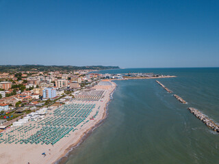 Italy, June 2022; aerial view of Fano with its sea, beaches, port, umbrellas in the marche region