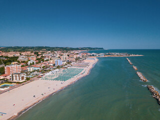 Italy, June 2022; aerial view of Fano with its sea, beaches, port, umbrellas in the marche region