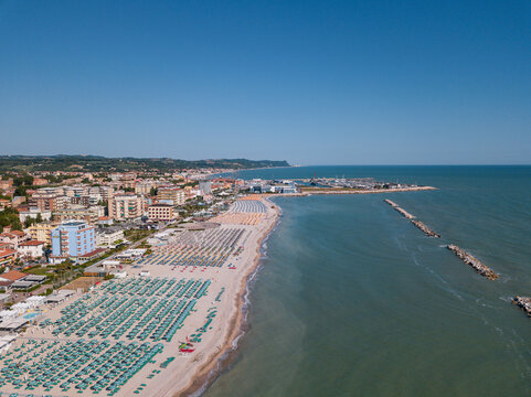 Italy, June 2022; aerial view of Fano with its sea, beaches, port, umbrellas in the marche region