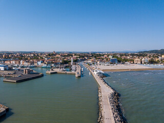 Obraz premium Italy, June 2022; aerial view of Fano with its sea, beaches, port, umbrellas in the marche region