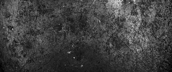 Grunge black texture. The texture of the scratches on the metal. Texture scratches background monochrome. Rough textured hard background. The surface is damaged.