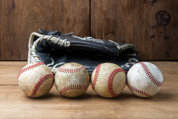 Vintage classic leather baseball glove and baseball ball isolated on white background