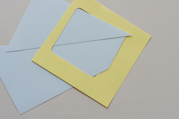 yellow frame and triangular forms on beige paper