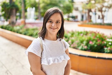 Naklejka premium Down syndrome woman smiling confident standing at park