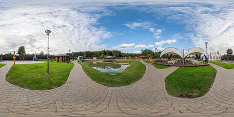 Full seamless 360 degree HDRI spherical panorama in park with lake and patio, guest tent and guest...