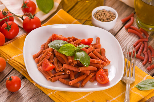 Lentil pasta with cherry tomatoes and basil.